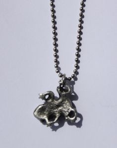 This is our hand cast, lead-free, fine pewter Toad Pendant Necklace on a 24 inch stainless steel military ball chain. The pewter pendant measures approximately 1 inch in diameter. It is hand cast/made in Michigan! It will be attached to our card in a clear package & would make a great gift! If you would like more quantity than what we have listed, please ask. We usually have more in stock OR we can let you know how long before we would have the quantity you need. You can add more pewter item Anglican Prayer Beads, Military Ball, Pewter Pendant, Hand Cast, Toad, Ball Chain, Jump Rings, Necklace Pendant, 1 Inch