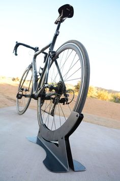 a bicycle is mounted on a metal stand