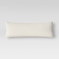 a white pillow on a gray background