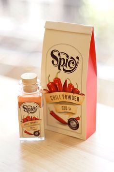 a bottle of chili powder next to a carton