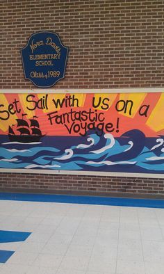 a sign on the side of a building that says set sail with us on a fantastic voyage