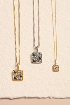 Handcrafted in both sterling silver and 14K gold, featuring a mixture of diamonds, blue topaz, and green zircon stones.