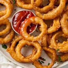 fried onion rings with ketchup on a plate