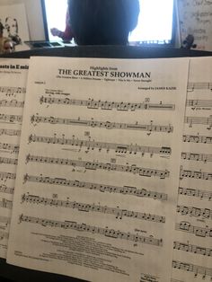 sheet music with the greatest showman written on it in front of a computer screen