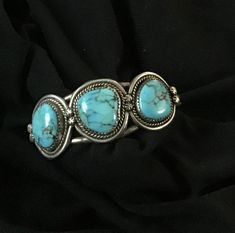 Original Vintage Native American Turquoise Bracelet - Acquuired from an antique shop in 70's expect it to be much older.  Jeweler told me in the 80's that it has to be pretty old as they do not set stones in sawdust anymore and that used to be done a long time ago.  Blue Turquoise stones set in serrated bezels - stones are set in sawdust - Sterling Silver - size medium 6 to 7" - cuff style - Signed with a large " J " stamped - May be Southwestern - reasonable OFFER accepted Classic Handmade Turquoise Bracelets, Oval Turquoise Collectible Bracelet, Classic Turquoise Adjustable Bracelet, Vintage Turquoise Bracelets As Gift, Antique Turquoise Adjustable Bracelet, Handmade Turquoise Vintage Cuff Bracelet, Antique Adjustable Turquoise Bracelet, Retro Round Turquoise Jewelry, Retro Turquoise Jewelry