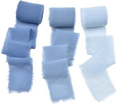 several different shades of blue fabric on a white background