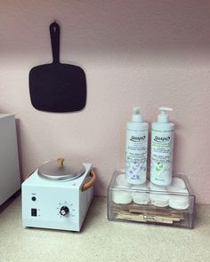 a kitchen counter with a blender, soap and other items