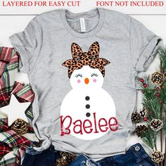 a snowman with leopard print on it's head and the word baeee