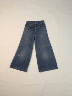 "1970s Levis bell bottom jeans made in USA orange tab SCOVILL zipper fly hemmed authentic age wear fade, fray, faded stains labeled 25 x 32, smaller/shorter, see below measures, lying flat, waist-12\" rise-10\" inseam-23 1/2\" hem-12\" hip-17 1/2\" out seam-33\" about 2\" could be added to length if unhemmed" Vintage Wide Leg Washed Pants, Vintage Washed Wide Leg Pants, Faded Vintage Wide-leg Bottoms, Vintage Wide Leg Denim Jeans, Vintage High Waist Medium Wash Flare Jeans, Vintage Dark Wash Flare Jeans, Retro Flare Jeans In Medium Wash, Retro Medium Wash Full Length Flare Jeans, Vintage Flare Bottoms In Medium Wash