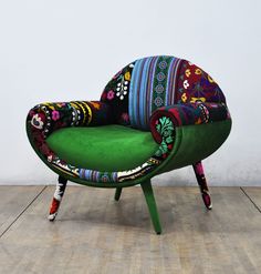 a colorful chair sitting on top of a wooden floor