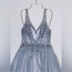 Camila Le Vie Cocktail Mini Dress Silver With Rhinestones New With Tag Perfect Condition Same Day Shipping Nr V-neck Rhinestone Dress For Gala, Elegant V-neck Evening Dress With Rhinestones For Prom, V-neck Rhinestone Dress For Prom Season, Sparkling V-neck Prom Dress, Formal V-neck Dress With Rhinestones, V-neck Party Gown With Rhinestones, Crystal Embellished Dresses For Homecoming And Prom, Crystal Embellished Dresses For Homecoming During Prom Season, Sparkling V-neck Dress For Homecoming