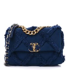 This is an authentic CHANEL Cotton Canvas Quilted Medium Chanel 19 Flap in Navy Blue.This soft shoulder bag is crafted of oversized quilted fabric in navy blue. The refined bag features a chain detail CC turn-lock on the flap, a magnetic snap pocket at the rear, and a leather threaded aged gold, ruthenium, and dark silver chain-link shoulder strap with a leather shoulder pad. The front flap opens to a blue fabric interior with a pocket. Chanel 19 Bag, Navy Blue Bag, Chanel Canvas, Navy Chanel, Chanel Crossbody, Chanel 19, Pink Quilts, Chanel Shoulder Bag, Chanel Model