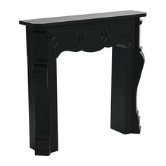 a small black fireplace with an ornate design