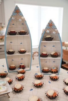 cupcakes are arranged in the shape of boats