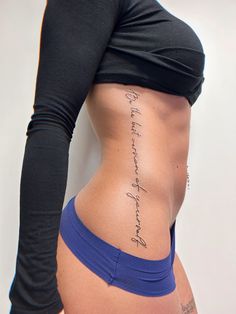 a woman with a tattoo on her stomach