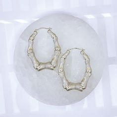 10K Oval Shaped Bamboo Hoop Earrings with White Gold Rhodium* Plating 2 3/4" width, 3" drop Lightweight for all day wear 10K Gold fortified snap bar closure keeps these babies securely closed Engraved with the affirmation "MM Luvs U" Charged in signature crystal grid and infused with Reiki for generational blessings (click for custom crystal grid charging and intuitively focused Reiki ) *Rhodium doesn't easily oxidize, corrode, or react to your skin. It's nickel-free and naturally hypoallergenic White Oval Sterling Silver Hoop Earrings, Oval 14k White Gold Hoop Earrings, 14k White Gold Oval Hoop Earrings, Silver Oval Tarnish Resistant Hoop Earrings, Yellow Gold Oval Hoop Earrings, Everyday Oval White Gold Hoop Earrings, Oval Nickel-free Hoop Earrings For Anniversary, Nickel-free Oval Hoop Earrings For Anniversary, Nickel-free Hoop Earrings For Anniversary