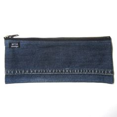 a small denim pouch with zipper closure