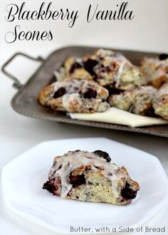 blackberry vanilla scones on a white plate with a baking pan in the background and text overlay that reads, blackberry vanilla scones