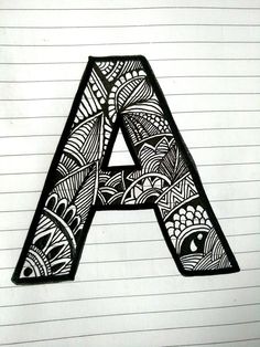 the letter a is made up of black and white doodled designs on lined paper