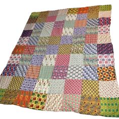 a multicolored patchwork quilt on white background