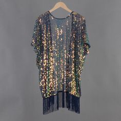 Welcome to my shop, I am in China. It will need around 30 days for international orders. Please consider the time when placing order. Sequin bohemian kimono,perfect for a casual day out. Material: mesh, sequins Body width available S: 27.5 inches(70cm), circle 55 inches(150cm) M: 31.5 inches(80cm), circle 63 inches(160cm) L: 35.5 inches(90cm), circle 71 inches(180cm) Body length available Short:33.5 inches (85cm) include tassels Long: 43.3 inches (110cm) include tassels CARE: Wash gently by hand in cold water.  Single wash. Don't press! Hang to dry.  Maybe you will like other items in my shop, find them here: https://www.etsy.com/shop/twogirlstudio Sequin Dress For Summer Festivals, Sequin Dress For Festival And Party Season, Disco Sequin Fabric For Summer Festivals, Bohemian Summer Party Kimono, Bohemian Kimono For Summer Party, Summer Party Bohemian Kimono, Bohemian Spring Party Kimono, Sequin Duster, Festival Kimono