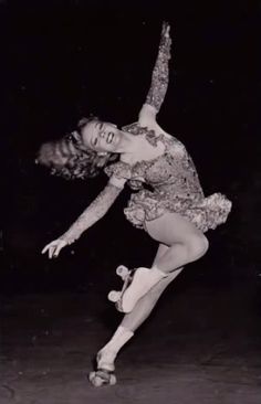 a black and white photo of a woman skating