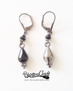 I love these Black Teardrop Dangle Earrings! The black teardrop faceted charm has a goth or victorian look and is made of rhinestones and gunmetal finished metal. The charm alone, measures 3/4 inches in length and about 3/8 inches wide and dangles from a round black crystal briolette bead with small pewter heishe beads on top and bottom. The earwires are gunmetal finished leverbacks. These fun and festive earrings are ready to ship and will arrive in a gift box. Check out other BrattonCraft Tear Black Metal Drop Earrings, Black Metal Teardrop Earrings, Black Teardrop Metal Earrings, Festive Earrings, Earrings Goth, Teardrop Jewelry, Victorian Earrings, Goth Earrings, Goth Jewelry