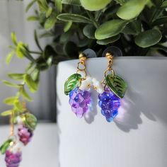 Our watercolor glass grape earrings are made with glass grape, glass flower, glass leaf and 14k gold plated earring hooks/ studs which are good for delicate ears. Size: the hook style is about 1.6" long and 0.6" widethe stud style is about 1.25" long and 0.6" wide Coworker Appreciation, Grapes Fruit, Grape Earrings, Fruit Food, Food Earrings, Fruit Earrings, Stud Style, Great Gifts For Women, Purple Watercolor