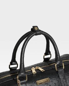 Elevate your travel essentials with the Premium Black Ostrich Leather Duffle Bag, designed for the discerning traveler seeking both style and functionality. Crafted from authentic ostrich leather, this duffle bag stands out with its unique texture and luxurious finish. Luxury Travel Duffle Bag With Adjustable Strap, Luxury Weekender Bag With Adjustable Strap And Double Handle, Luxury Weekender Bag With Adjustable Strap, Luxury Weekender Bag With Zipper Closure, Luxury Travel Bag With Adjustable Strap For On-the-go, Luxury Duffle Bag With Adjustable Strap For Travel, Luxury Textured Leather Tote Travel Bag, Luxury Textured Leather Travel Tote Bag, Elegant Textured Leather Duffle Bag For Business Trips