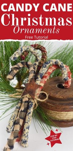 5 colorful handmade candy cane ornaments tied with a jute twine and a rusty star. Lying on an old wooden spool near some green pine needles. Handmade Christmas Trees, Rustic Christmas Tree Crafts, Hand Made Christmas Tree, Rustic Crafts To Sell, Homemade Christmas Tree Ornament, Easy Primitive Christmas Crafts, Rustic Christmas Diy Crafts, Christmas Tree Ornaments 2022, Christmas Ornaments With Fabric