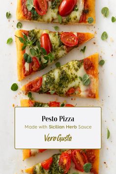 four slices of pizza with tomatoes, cheese and basil on top that are topped with pesto