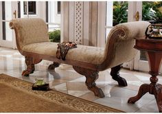 an ornate wooden bench sitting on top of a tiled floor