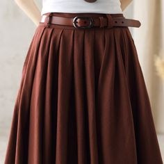 "DETAIL * 50% linen, 50% cotton * Right hidden zipper closure * Knee length * Pockets available * Pleated skirt * Perfect for spring, summer * Wash by hand or machine with cold water * The model is 168 cm (5′ 6″) tall with a 80 cm (31.5\") bust, 66 cm (26\") waist. She is wearing the brown skirt in size XS. Choose CUSTOM Order if you * Need a better fit * Can't find your size in our size Chart * Change the Style * Chang the Length * Your Height is not Between 5'1\" - 5\"9\" * Your weight from 47 Classic Full Skirt With Pleated Hem, Classic A-line Skirt With Pleated Waist, Classic Full Skirt With Pleated Waist, Elegant Brown Flared Mini Skirt, Classic Pleated Midi Skirt, Solid Color Flared Pleated Skirt, Solid A-line Skirt With Accordion Pleats, Solid A-line Pleated Skirt With Accordion Pleats, Classic Pleated Full Maxi Skirt