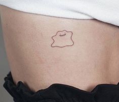 a woman's stomach with a small tattoo on it