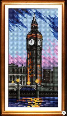 the big ben clock tower in london, england cross stitch pattern with gold framed frame