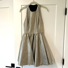 Perfect For A Night Out Dress, Racerback Dress, Covered In Gold/Silver Sparkles. Worn Once, In Great Condition. Sleeveless Metallic Mini Dress With Glitter, Metallic Shimmer Sleeveless Mini Dress, Sleeveless Embellished Metallic Mini Dress, Olivia Gold, Metallic V-neck Mini Dress With Sequins, Alice + Olivia Dress, Racerback Dress, Out Dress, Night Out Dress