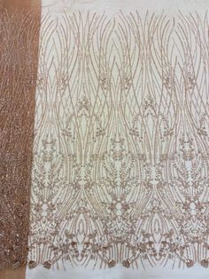 two different types of laces are shown on the table top, one is brown and white