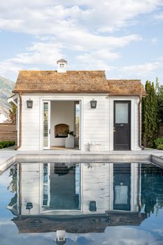 a small pool house with a swimming pool