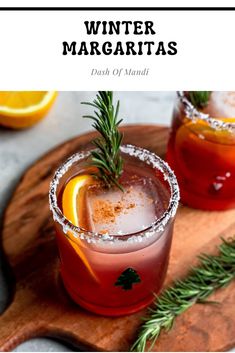 winter margaritas with orange and rosemary garnish