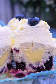 a blueberry ice cream dessert with two scoops cut out and ready to be eaten