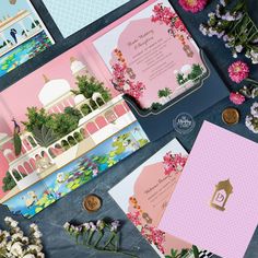 the wedding stationery is laid out on top of each other