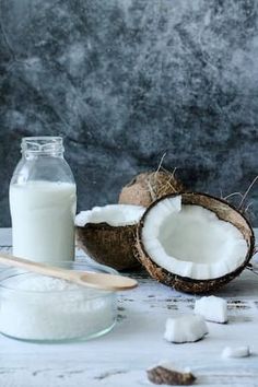 coconuts, milk and sugar on a white table