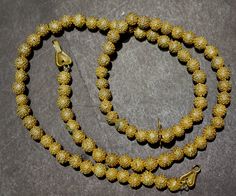 "Antique Yoruba gold wash granulated brass bead necklace from the African trade. 23\", 6.5 mm beads." Yellow Gold Beaded Necklace With 8mm Round Beads, Antique Gold Beaded Jewelry With Round Beads, Gold Beaded Spiritual Temple Necklace, Hand-strung Yellow Gold Beaded Necklaces, Yellow Gold Hand-strung Beaded Necklaces, Yellow Gold Hand-strung Beaded Necklace, Elegant Hand-strung Gold Beaded Necklaces, Elegant Gold Hand-strung Beaded Necklaces, Gold Single Strand Beaded Necklace With Round Beads