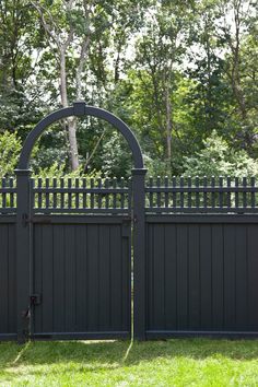 a black fence with an arched top