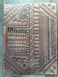 an old piece of cloth with designs on it