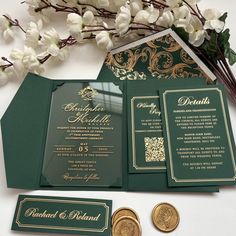 the wedding stationery is green and gold, with matching envelopes that are embellished