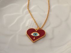 Gold red heart evil eye necklace, Gold stackable ring,Greek jewelry, Gold red heart charm, Valentine's red heart jewelry, Lover's jewellery Material and Size -Size of heart is 25,4 mm X 22,6 mm -Material :Gold plated 24 k Pewter with high quality red enamel which decorated with a colored ethnic evil eye -Pewter is very durable and is not tarnish easily If you follow care instructions also is lead and nickel free and is not causes allergic reactions Size of chain :This chain is made from stainles Spiritual Jewelry For Her On Valentine's Day, Spiritual Jewelry For Valentine's Day Gift, Spiritual Jewelry Gift For Valentine's Day, Charm Jewelry For Her As A Valentine's Day Gift, Red Pendant Jewelry As Gift For Her, Red Pendant Jewelry As A Gift For Her, Red Personalized Jewelry For Mother's Day, Personalized Red Jewelry For Mother's Day, Personalized Red Jewelry For A Gift