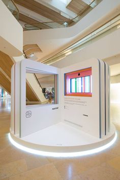 a display in the middle of a building with colorful windows