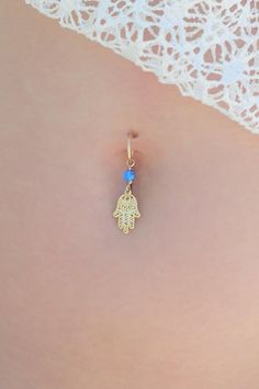 A feminine and delicate Hamsa belly button ring made with a unique blue opal stone. This navel piercing is handmade of a 14k gold filled or Sterling Silver hoop and a Hamsa hand pendant.The Hamsa (or Hand of Fatima) is a middle-eastern symbol of good luck, to keep evil spirits away.Wear it or give it to a loved one to use as an amulet to give protection and good luck.▸▹♥♥ Do not hesitate to contact me for special requests and customization! ♥♥ ▹▸▹▸▹▹▸▹▹▸▹▹▸▹▹▸▹▹▸▹▹▸▹▹▸▹▹▸▹▹▸▹▶ 14K Goldfilled or Dangle Belly Rings For Wedding, Delicate Body Jewelry As Gift, Dainty Internally Threaded Belly Rings As Gift, Adjustable Pierced Belly Rings As Gift, Nickel-free Dangle Belly Rings As Gift, Adjustable Blue Belly Rings As Gift, Nickel Free Dangle Belly Rings Gift, Dainty Nickel-free Belly Rings As Gift, Sterling Silver Dangle Belly Rings For Gift