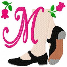 a pair of shoes with the letter m on it's side and flowers in the middle